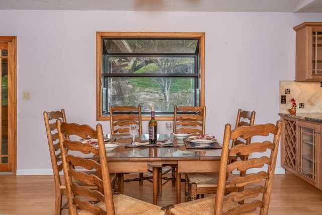 dining area with light hardwood / wood-style flooring