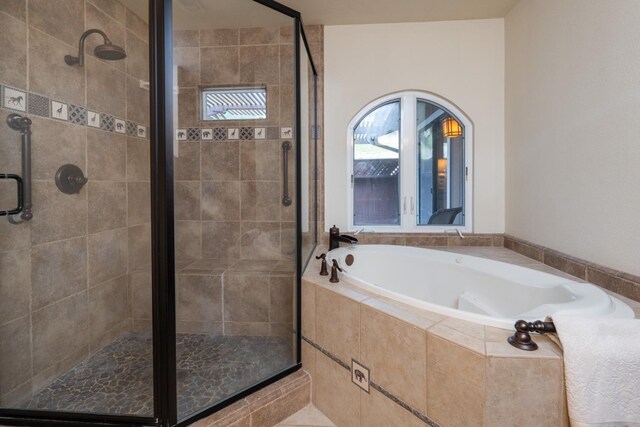 bathroom featuring plus walk in shower