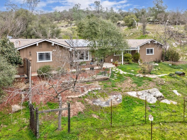 back of property with a patio and a lawn