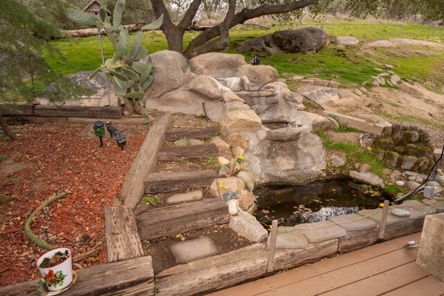 41925 Longhollow Dr, Coarsegold, CA 93614 - exterior details featuring a garden pond