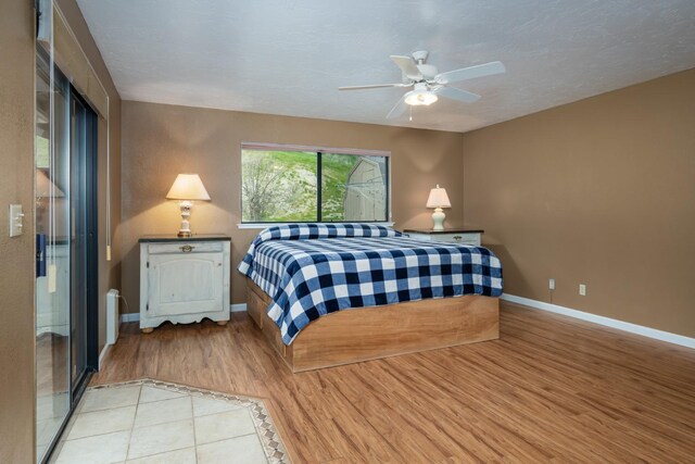 41925 Longhollow Dr, Coarsegold, CA 93614 - bedroom with a ceiling fan, wood finished floors, and baseboards