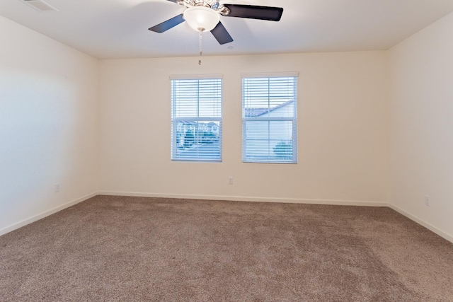 unfurnished room with carpet and ceiling fan