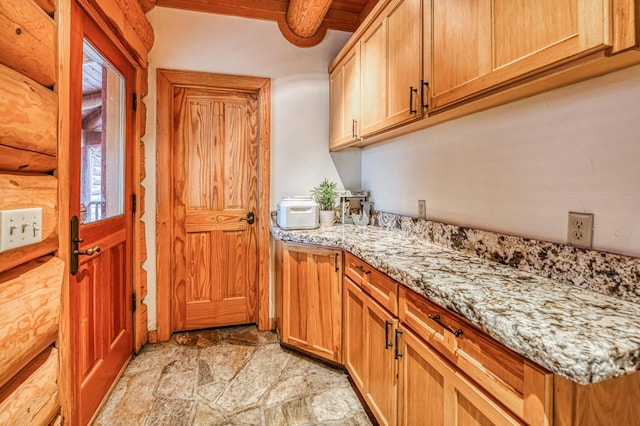12755 Rusty Spur Ln, Clovis, CA 93619 - laundry area featuring light stone finish floors