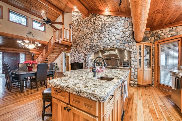 12755 Rusty Spur Ln, Clovis, CA 93619 - kitchen with a sink, light wood-type flooring, wooden ceiling, high vaulted ceiling, and beamed ceiling