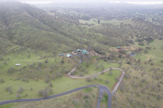 birds eye view of property featuring a mountain view and a rural view