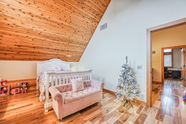 bedroom featuring wood ceiling, lofted ceiling, and light wood-type flooring