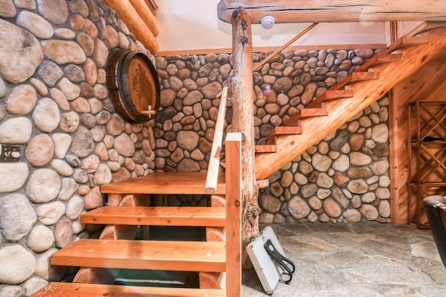 stairs featuring log walls