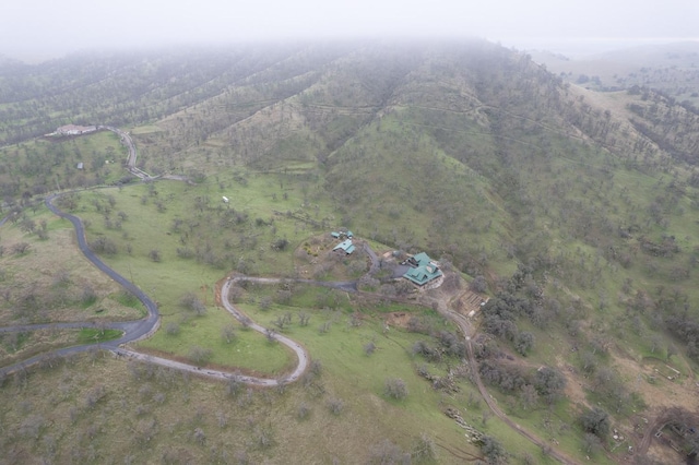 birds eye view of property featuring a rural view