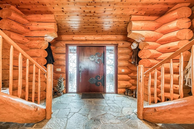 entryway featuring log walls, wood ceiling, and lofted ceiling