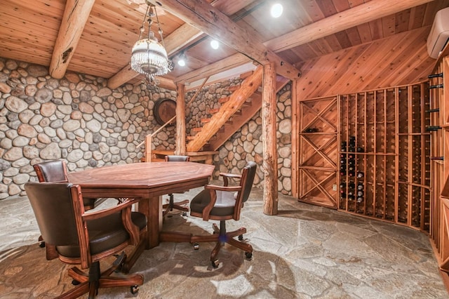 12755 Rusty Spur Ln, Clovis, CA 93619 - wine room with wood ceiling, beamed ceiling, stone floors, a wall unit AC, and a chandelier