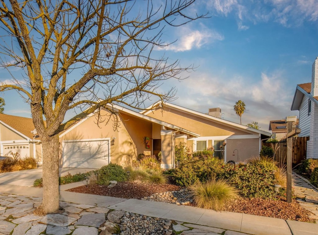 ranch-style house featuring a garage