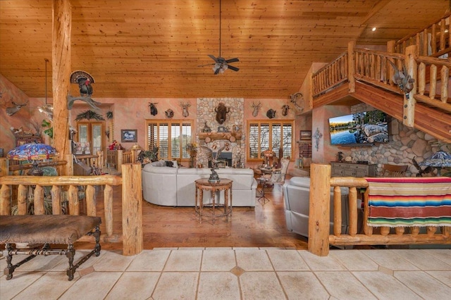 tiled living room featuring ceiling fan, high vaulted ceiling, and wooden ceiling