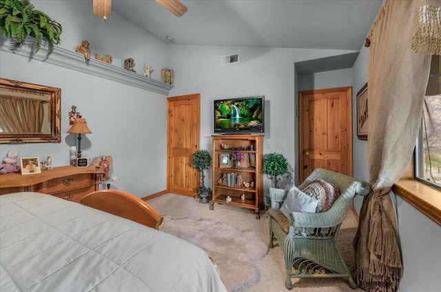 carpeted bedroom with vaulted ceiling and ceiling fan