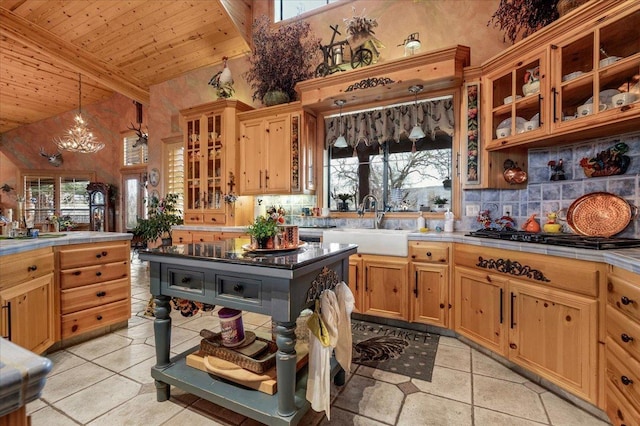 kitchen featuring a wealth of natural light, wooden ceiling, hanging light fixtures, and high vaulted ceiling