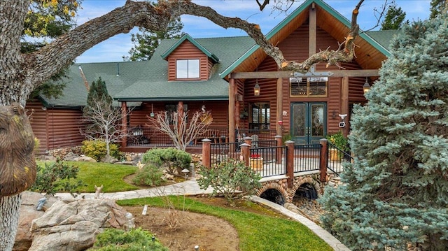 log home with covered porch