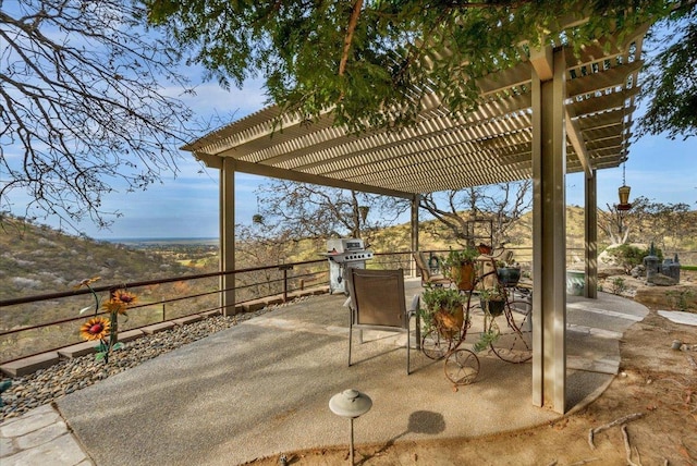 view of patio / terrace featuring a pergola and area for grilling