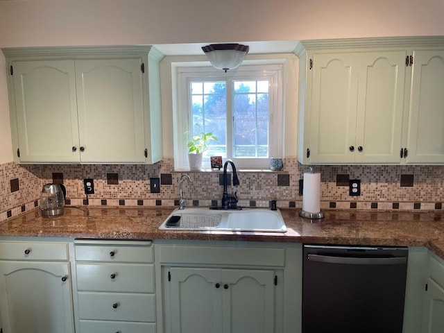 kitchen featuring tasteful backsplash, sink, and dishwasher