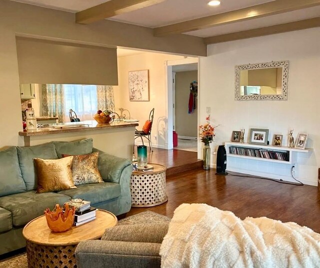 living room featuring dark hardwood / wood-style flooring and beamed ceiling