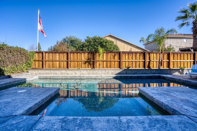 view of pool featuring a jacuzzi