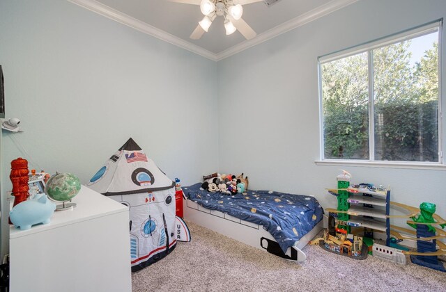 bedroom featuring carpet flooring, ceiling fan, and crown molding