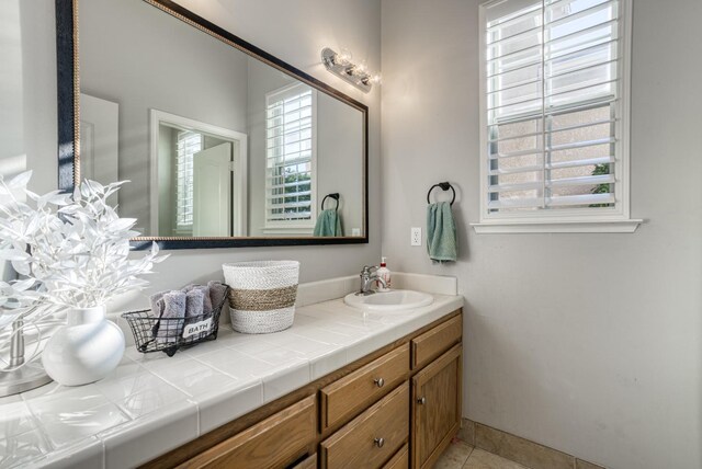 bathroom with tile patterned flooring and vanity