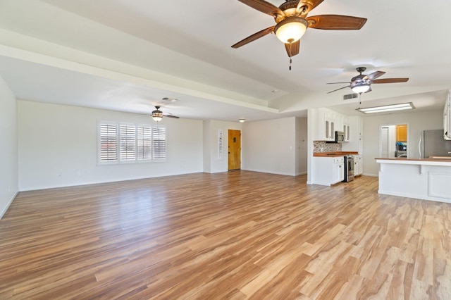 unfurnished living room with light hardwood / wood-style flooring