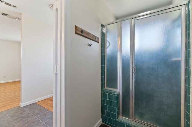 bathroom featuring tile patterned floors and walk in shower