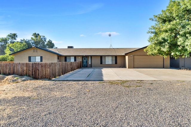 ranch-style home featuring a garage