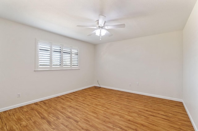 empty room with ceiling fan and light wood-type flooring