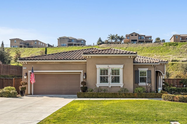 view of front facade featuring a garage and a front lawn