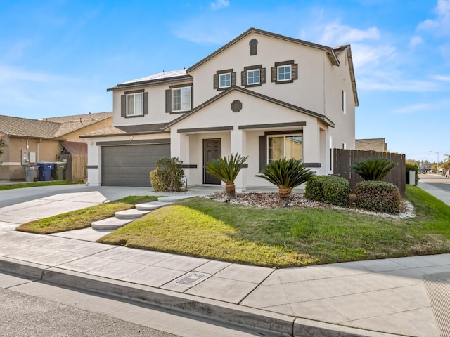 front of property featuring a front yard and a garage