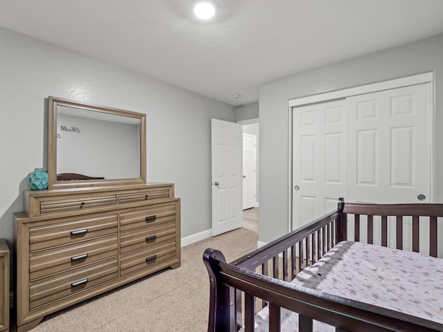 carpeted bedroom with a closet