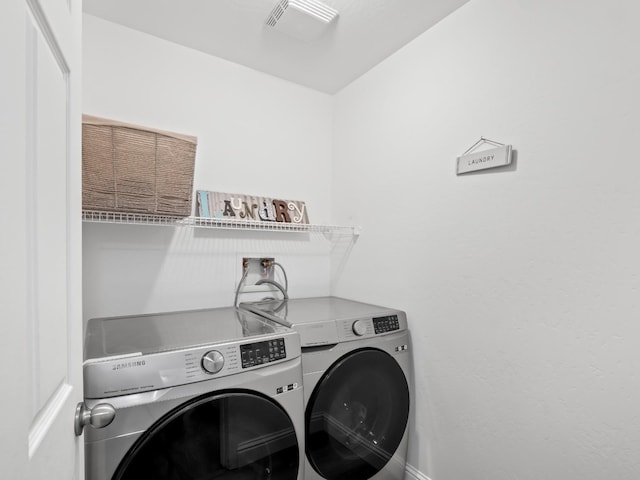 laundry room with washer and dryer