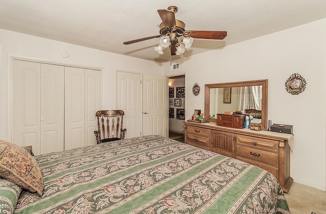 carpeted bedroom with ceiling fan