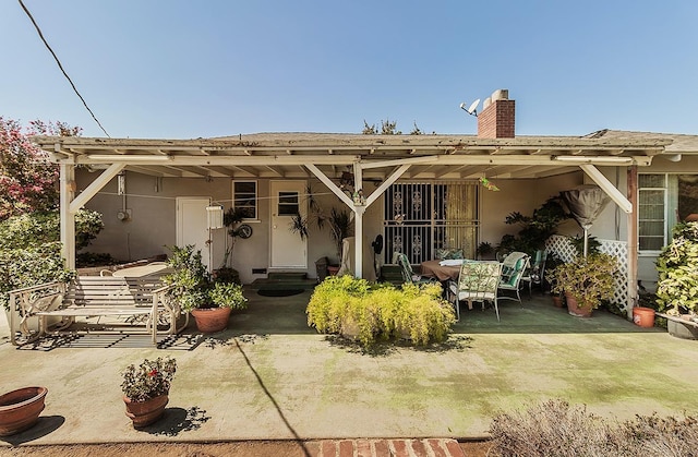 back of house with a patio area