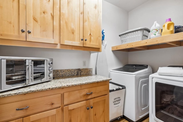 laundry area with cabinets and independent washer and dryer