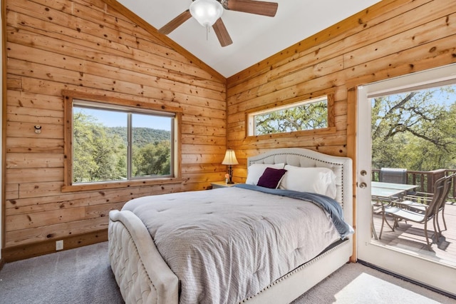 bedroom featuring carpet flooring, vaulted ceiling, and ceiling fan