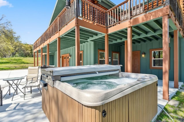 view of patio / terrace with a hot tub