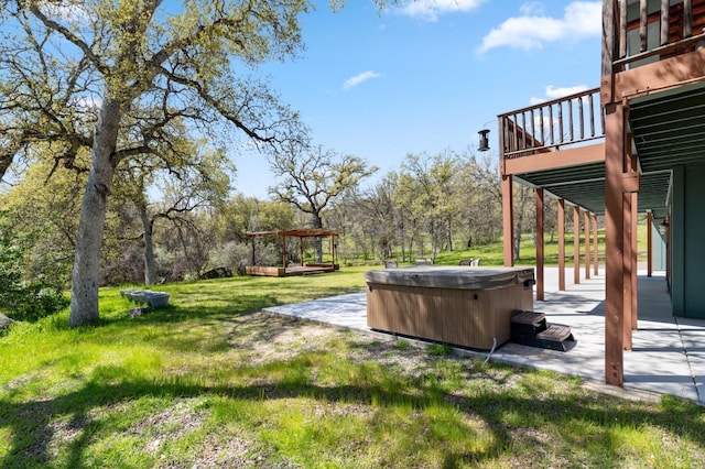 view of yard with a patio, a hot tub, a pergola, and a wooden deck