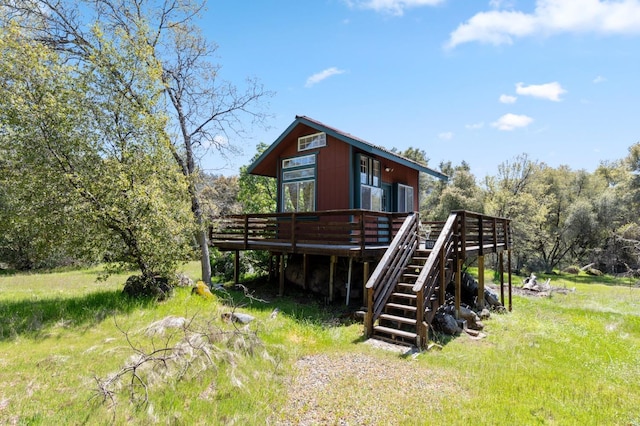 back of house featuring a deck