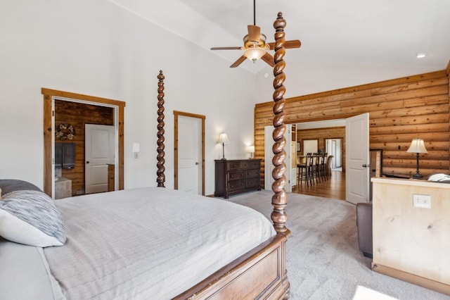 bedroom with ceiling fan, light colored carpet, log walls, and vaulted ceiling