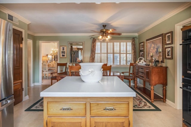 kitchen with ceiling fan, a center island, stainless steel fridge, crown molding, and light brown cabinetry