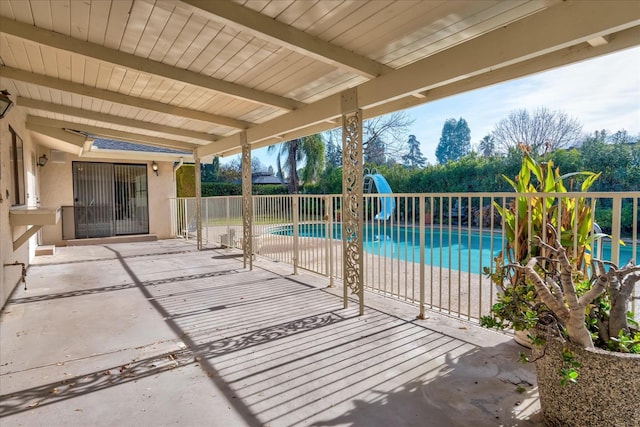 view of swimming pool with a patio area