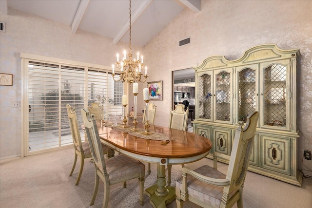 carpeted dining area with beam ceiling, high vaulted ceiling, and an inviting chandelier