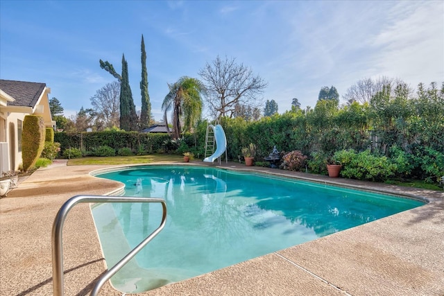 view of pool featuring a water slide