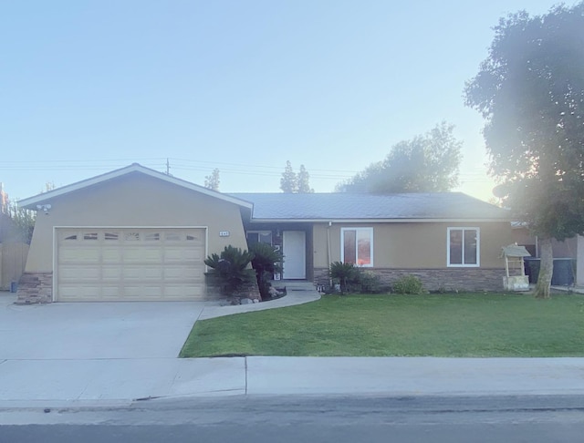 ranch-style house with a front yard and a garage