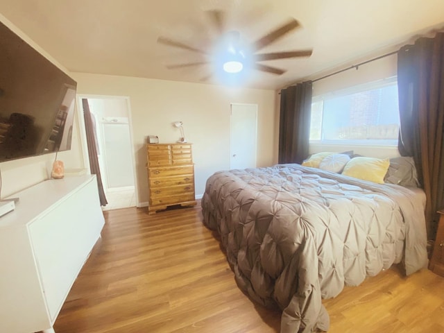 bedroom with ceiling fan and light hardwood / wood-style floors