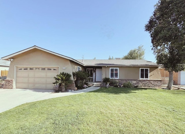 ranch-style home featuring a garage and a front yard