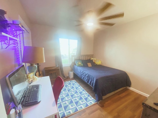 bedroom featuring ceiling fan and hardwood / wood-style flooring