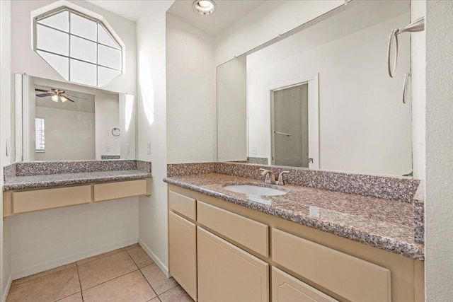 bathroom with tile patterned floors, ceiling fan, plenty of natural light, and vanity